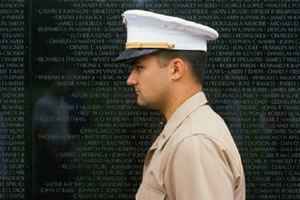 military man at memorial wall