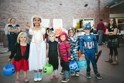 children dressed in Halloween Costumes